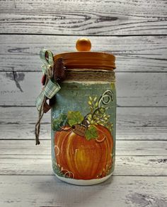 a jar with a pumpkin painted on it