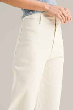 upgrade your casual wardrobe with these zara-dupe, cream wide-leg cut-off denim pants, a versatile blend of comfort and contemporary style. crafted from premium denim with stretch, these pants feature a flattering high-rise waist and a wide-leg silhouette that offers a relaxed, yet chic look. pairs effortlessly with both casual tees and dressier tops. finished with a cut-off hem for a modern edge, these pants are ideal for creating effortless day-to-night outfits. 98% cotton | 2% spandex back po Trendy Wide Leg Neutral Jeans, Trendy Beige Wide Leg Jeans, High Rise Beige Wide Leg Pants With Relaxed Fit, High Rise Cotton Wide Leg Pants With Frayed Hem, Beige Relaxed Fit Flare Jeans For Spring, Chic Wide-leg Flare Jeans With Frayed Hem, Cream Cropped Leg Cotton Pants, Beige Cropped Leg Wide Pants In Cotton, Beige Cropped Wide Leg Cotton Pants