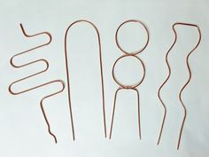 four pairs of copper wire on a white background with the word'80'spelled out