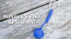 there is a blue rope attached to the handle of a keychain that says monkey's fist kerchhan