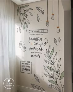 the wall is decorated with drawings and words