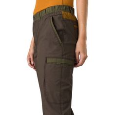 The prAna Double Peak Pant, built with a blend of organic cotton and recycled polyester, features a variety of pocket space, moisture-wicking properties, and an elastic waistband for a secure fit. Green Bottoms With Patch Pockets For Outdoor Activities, Long Pants Bottoms With Patch Pockets For Outdoor Activities, Practical Hiking Bottoms With Pockets, Functional Cotton Pants With Side Pockets, Tapered Leg Hiking Bottoms With Pockets, Functional Cotton Trousers, Cotton Parachute Pants For Hiking, Functional Cotton Pants With Pockets, Functional Cotton Bottoms With Side Pockets