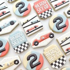 decorated cookies with race cars and numbers on them