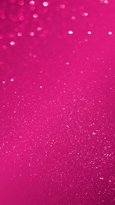 a pink background with lots of small white dots on the top and bottom half of it