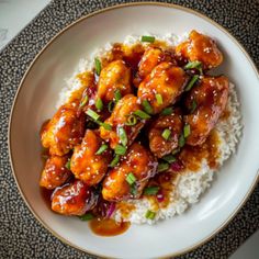 a white plate topped with chicken and rice