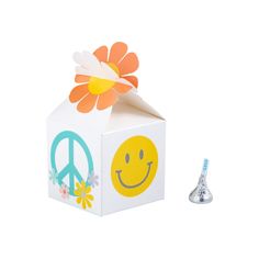 a white box with a flower and peace sign on it