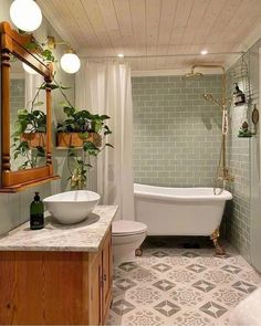 a bath room with a toilet a tub and a sink