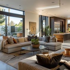 a living room filled with furniture and lots of windows