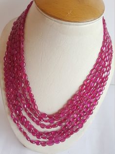 "PRODUCT DESCRIPTION :-- Elegant Precious Gemstone Beaded Ruby Necklace ✦ Stone Name : Natural Ruby ✦ Origin :--- Africa ✦ Gemstone Shape:--- Oval ( smooth ) ✦ Length :-- \"18-20\"Inches of Rubies comes in silk tassel ✦ Color :--- Pink ✦ Carats:-- 891 ✦ Quality:--- AAA ✦ Size :--- 6-8 MM The photographs of the items have been taken in natural daylight, without any enhancements or affects and all attempts have been made to depict the colour of the gemstones accurately. Due to the use of gemstones Cheap Oval Gemstone Beads Necklaces, Elegant Gemstone Oval Beads, Elegant Faceted Oval Beads, Elegant Oval Gemstone Beads, Elegant Oval Faceted Beads, Gems And Cabochons, Ruby Beads, Ruby Necklace, Carnelian Beads, Ruby Jewelry