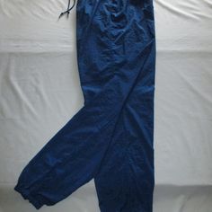 Nike Leisure Pants - Royal Blue - (M 8-10) Nwot Nike Leisure Pants With Drawstring Elastic Waist, Zipper On Each Lower Leg With Elastic Hem, Three (3) Pockets; One On Each Side With An Additional Tab Velcro Inner Pocket To Secure Keys, Cash, And I.D.; Can Be Worn Over Swim/Workout. Size M/8-10. Approx. Measurements Are: 25 ¼” Around/Diameter Without Elastic Stretch, Stretch To 16” Flat (32”), Hips 22” Flat (44”), Inseam 31 ½”, Ankle Zipped With No Stretch 10 ¼” Around/Diameter, Zipper On Leg 12” Blue Stretch Straight Leg Cargo Pants, Stretch Blue Cotton Cargo Pants, Blue Stretch Cotton Cargo Pants, Blue Full Length Sweatpants With Pockets, Blue Stretch Cargo Pants For Spring, Casual Blue Full-length Cargo Pants, Casual Blue Cargo Pants, Blue Full Length Casual Pants, Blue Cargo Pants With Elastic Waistband And Tapered Leg