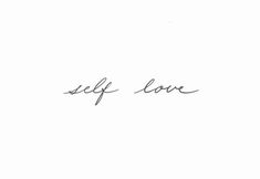 the word self love written in cursive handwriting