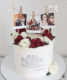 a white cake with pictures and flowers on it