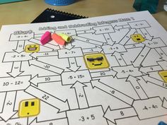 an image of a game that is being played on the table with markers and pencils