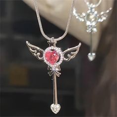 Description:Pink Heart Magic Wand Necklace Specifications:Material: swarovski crystal, cubic zirconia, copper, 18k silverColors: silverSize: 41.2 cm + 6.3 cm extWeight: 6.5 g/pcs This charming necklace features a pink heart-shaped magic wand pendant, perfect for the enchanting fashionista. Turn heads and cast a love spell with this quirky accessory. (✨🧙‍♀️) Cast A Love Spell, Cute School Stationary, Magical Accessories, Life Partner, Crystal Magic, Gem Necklace, Girl Jewelry, Enamel Bracelet, Magic Wand