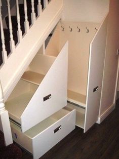 an under the stairs storage unit with drawers