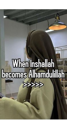 a woman in a hijab looking at her cell phone with the caption, when insalah becomes alhamdullillah