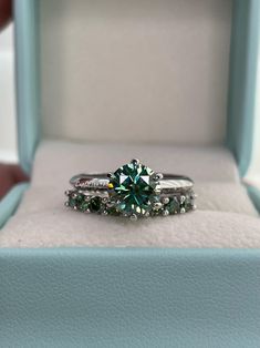 a green ring sits in a blue box