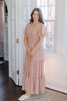 The Valorie Maxi Dress was made for warm days in the sun! This long, tiered dress is cut from lightweight fabric and is fully lined to let you move through the day in breathable all-day comfort. The pullover style features a smocked waist, flutter sleeves and a v-neckline. The perfect modest dress for Easter Sunday, a photoshoot, or summer soiree! Pair it with slide sandals or wedge heels and complete your look with a woven bag and stylish shades when out and about! 100% Polyester Wash Cold Insi Summer Soiree, Easter Dress, Tiered Maxi Dress, Easter Sunday, Woven Bag, Tiered Dress