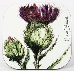 a purple flower on a white square coaster