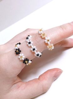 Beautiful Flower Bead Ring - Add a little bit of fanciness to your everyday outfit!! **Due to the handmade nature, sizing and colors may vary slightly with each piece. Sizing is approximate and is based on US sizing. Size Reference (Approxi) US 5 - 50mm US 7 - 55mm US 9 - 60mm US 11 - 65 mm **You can also personalize your ring size by selecting 'Custom Size' Care Instructions -Recommend avoiding contact with water (Remove it before getting in the shower or cleaning) -For longevity, the jewelry should be treated gently (No stretching or playing) Please Note -Due to the nature of handmade items, the product you receive may differ slightly from the picture. -Avoid playing with them as it will break. -Due to the fact that every piece of jewelry is made to order cancellations, returns or exchan Handmade Adjustable White Flower Ring, Adjustable Handmade White Flower Ring, Adjustable White Handmade Flower Ring, Handmade White Flower Ring In Cute Style, Handmade White Flower Ring, Cute Style, Handmade White Flower Ring, Handmade Cute White Flower Ring, Cute Handmade White Flower Ring, Handmade Flower Ring With Round Beads For Gift