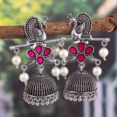 Overview These stylish Jhumka Earrings set from JewelryTrack will certainly leave you spellbound. These Jhumka Earrings set have an excellent finish and gives out an exquisite sense of style. If you are looking for an amazing Fashion Jewelry set for special occasions such as Anniversary, Engagement, Party, Wedding or for gifting , then your search ends here.  Item Description: The look is stunning and preciously suitable for all kinds of dressy occasions. COLOR : Silver  Metal: Brass With Good Q Festive Red Peacock Design Earrings, Festive Red Peacock Earrings, Peacock Design Jhumkas For Navratri Puja, Navratri Peacock Design Jhumkas For Puja, Navratri Puja Peacock Design Jhumkas, Festival Peacock Design Jhumkas For Parties, Multicolor Peacock Design Earrings For Festivals, Peacock Design Jhumkas For Party And Festivals, Party Peacock Design Jhumkas For Festivals