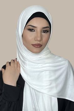 We've designed our Classic Jersey hijab-Off White so that it provides you with the breathability needed to wear it year round. Made from a cotton jersey fabric that is durable yet lightweight, you won't have to worry about a heavy or stiff hijab weighing you down on a warm day. This hijab will seamlessly incorporate into your everyday wardrobe. Fabric: Cotton, Lycra, Viscose Dimension: 67"x 22" Contour: Long Rectangle Thickness: Light Texture: Smooth Care: Machine or hand wash in warm water, tum White Jersey Hijab, Casual Cotton Hijab, Hijab Brand, Jersey Hijab, Hijab Pins, Cotton Jersey Fabric, White Jersey, Light Texture, Print Chiffon