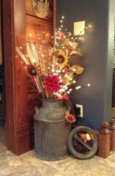 a vase filled with flowers sitting on top of a floor