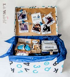 an open suitcase with pictures and magnets on it