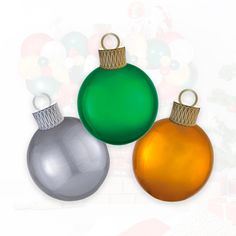 three shiny christmas ornaments are shown against a white background with red, green and silver baubles