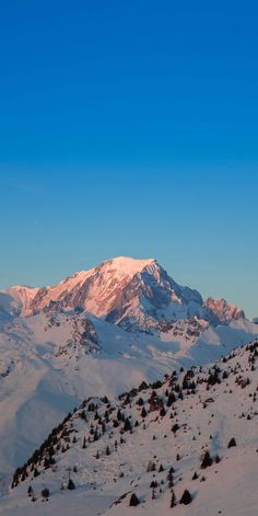 the mountains are covered in snow and there is no image on this page to describe