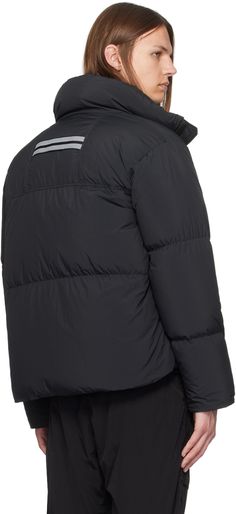 Down-filled and quilted EnduraLuxe nylon taffeta jacket. Water-repellent, lightweight, and durable. · Stand collar · Two-way zip closure · Zip seam pockets · Logo patch at sleeve · CORDURA® piping at cuffs · Inset rib knit cuffs · Reflective webbing trim at back collar · Locker loop at inner collar · Shoulder straps at interior · Zip pocket and mesh pockets · Full satin lining Supplier color: Black Fill: 90% duck down, 10% duck feather. Sporty Quilted Nylon Puffer Jacket, Streetwear Quilted Nylon Jacket With Padded Collar, Sporty Nylon Quilted Jacket For Cold Weather, Black Quilted Nylon Jacket With Zipper Closure, Outdoor Quilted Nylon Jacket With Padded Collar, Sporty Nylon Quilted Jacket For Outdoor Activities, Weatherproof Nylon Puffer Jacket For Streetwear, Black Nylon Quilted Jacket For Outdoor, Taffeta Jacket