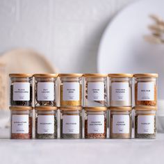 the jar labels are labeled with different types of spices and seasonings in each container