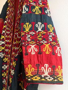 Fantastic traditional Turkmen robe/duster. Vivid colors and carefully embroidered workmanship. One of the best examples of this type of traditional wear we have come across. Infinitely wearable and looks great with jeans and boots. Add flair to a jeans and t uniform. Fabric: cotton/silk/ otherFit: S/MEra: 1940's Measurements: Bust 48" Sleeve (from collar) 32" Length 43" Waist 48" Hips 52" Condition: Excellent Traditional Kaftan With Geometric Embroidery For Festivals, Traditional Cotton Tunic Kimono, Folk Style Kimono With Multicolor Embroidery, Traditional Multicolor Embroidered Geometric Kaftan, Traditional Cotton Kimono With Multicolor Embroidery, Folk Style Embroidered Multicolor Kimono, Folk Style Embroidered Ceremonial Kaftan, Traditional Multicolor Embroidered Kimono For Fall, Traditional Fall Kimono With Multicolor Embroidery