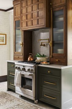 a kitchen with an oven, stove and cabinets in it's center island area