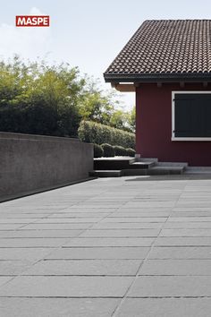 a man riding a skateboard on top of a sidewalk