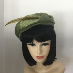 Original Roberta Bernays sage green hat with a stylish feather. The hat has peaked details and is very sophisticated. Interior is lined with lace. In very good to excellent vintage pre owned condition. Very light discoloration at the interior headband possibly from make up. May clean out but I was afraid to try. Not visible when wearing this lovely hat. Comes with a small original hat pin. Can be worn in various ways. Interior measures: 20.5" interior Height: approx: 2.5" not including the feather. Please contact me if you need more information before making a purchase. Vintage Hats With Feather Trim And Short Brim, Vintage Wide Brim Hat With Feather Trim, Vintage Hats With Feather Trim And Adjustable Fit, 30s Feather Hat, Vintage Adjustable Hat With Feather Trim, Green Hats, Hat Pins, Hat Designs, Sage Green