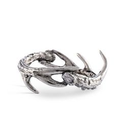 a silver ring with two horns on it