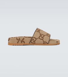 Maxi GG canvas slides in beige - Gucci | Mytheresa Designer Brown Slides With Cushioned Footbed, Designer Slides With Rubber Sole And Round Toe, Designer Open Toe Slides With Rubber Sole, Designer Cushioned Slides Slip-on, Designer Slides With Round Toe And Rubber Sole, Designer Cushioned Slip-on Slides, Gucci Designer Slip-on Slides, Designer Gucci Slip-on Slides, Designer Gucci Slides With Rubber Sole