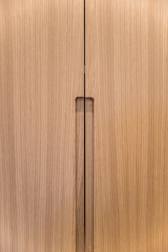 a close up view of a wooden cabinet door