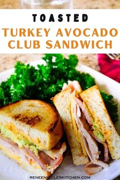 turkey avocado club sandwich on a white plate