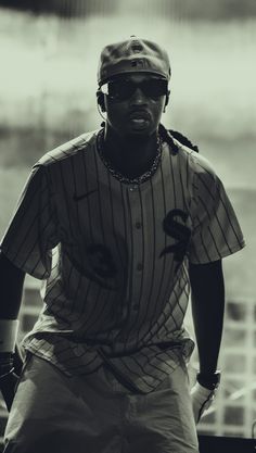 a black and white photo of a baseball player