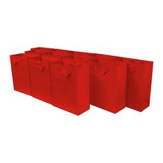 six red bags are lined up against each other on a white background with no one in the photo