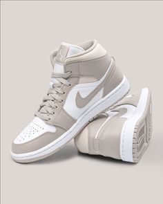 Looking for the perfect sneaker? This two-toned pair starts with a smooth white leather base that dominates the side panels and perforated toe box, while light grey leather overlays in the mudguard, eye stays and ankle collar dress the otherwise colorless upper. Tag us in your OOTD pictures with #styleyourpair! Custom Air Jordan 1, Beige Sneakers, Dr Shoes, Nike Shoes Girls, Nike Fashion Shoes, Preppy Shoes, Jordan Shoes Retro, All Nike Shoes, Cute Nike Shoes