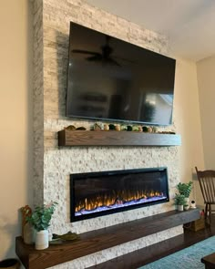 a fireplace with a flat screen tv above it