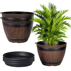 three wooden planters with plants in them and one is black, the other has brown