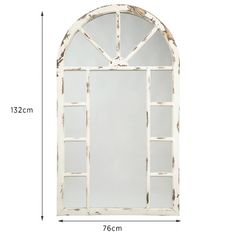 an arched window with white paint on the side and glass in the middle, against a white background