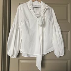 New With Tags New York & Company White Shirt Blouse Puff Bell Sleeves With Bow Collar On Neck Long Sleeves Office, Career Professional 7th Avenue Design Studio Size: Large 60% Cotton 35% Polyester 5% Spandex Chic Bishop Sleeve Tops For Day Out, Chic Day Out Blouse With Bishop Sleeves, Chic Bishop Sleeve Blouse For Day Out, Chic Blouse With Bishop Sleeves For Day Out, Spring Workwear Blouse With Bishop Sleeves, Spring Bishop Sleeve Blouse For Work, White Puff Sleeve Top With Bishop Sleeves For Spring, White Bishop Sleeve Puff Top For Spring, Chic White Puff Sleeve Top With Bishop Sleeves