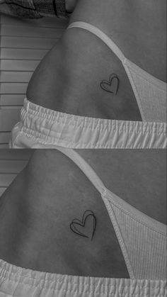 two women's butts with small hearts on their stomach and one has a heart in the middle