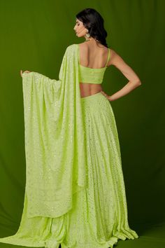 Hawaiian lime green lehenga with chikankari hand embroidery in paisley motifs and mukaish work. Paired with embroidered blouse and embroidered dupatta.
Component: 3
Pattern: Hand Embroidery
Type Of Work: Mukaish, Chikankari
Neckline: Sweetheart
Sleeve Type: Sleeveless
Fabric: Georgette
Color: Green
Other Details: 
Mukaish work
Paisley motifs
Embroidered dupatta
Occasion: Mehendi,Sangeet - Aza Fashions Green Chikankari Embroidered Pre-draped Saree For Diwali, Green Chikankari Embroidery Pre-draped Saree For Diwali, Green Chikankari Pre-draped Saree For Diwali, Green Pre-draped Saree With Chikankari For Diwali, Traditional Green Choli With Chikankari Embroidery, Green Sleeveless Choli With Pallu, Sleeveless Green Choli With Pallu, Green Sleeveless Designer Choli, Pista Green Chikankari Embroidery Lehenga