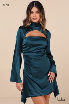 Get ready to be the most stunning sight at any party this season with the Lulus Sultry Elevation Dark Teal Satin Long Sleeve Cutout Mini Dress! Sleek, stretch-woven satin shapes this must-have dress that features long sleeves with flaring cuffs, flowing into an overlapping crisscross design that creates a chic mock neckline. Flirty cutouts at the front and back sit above the figure-flaunting silhouette that boasts ruching along the sides and continues down to an A-line mini skirt with a draping, asymmetrical hem. Button-loop closures secure the neckline. Hidden zipper/clasp at back. Fit: This garment fits true to size. Length: Mid-thigh. Size medium measures 44.5" from shoulder to hem. Bust: Great for any cup size. Waist: Fitted - very fitted at natural waist. Hip: Not Fitted - fuller skir Cutout Mini Dress, Satin Long Sleeve, A Line Mini Skirt, Mock Neckline, Dark Teal, Cutout Dress, Asymmetrical Hem, Cup Size, Dress 100